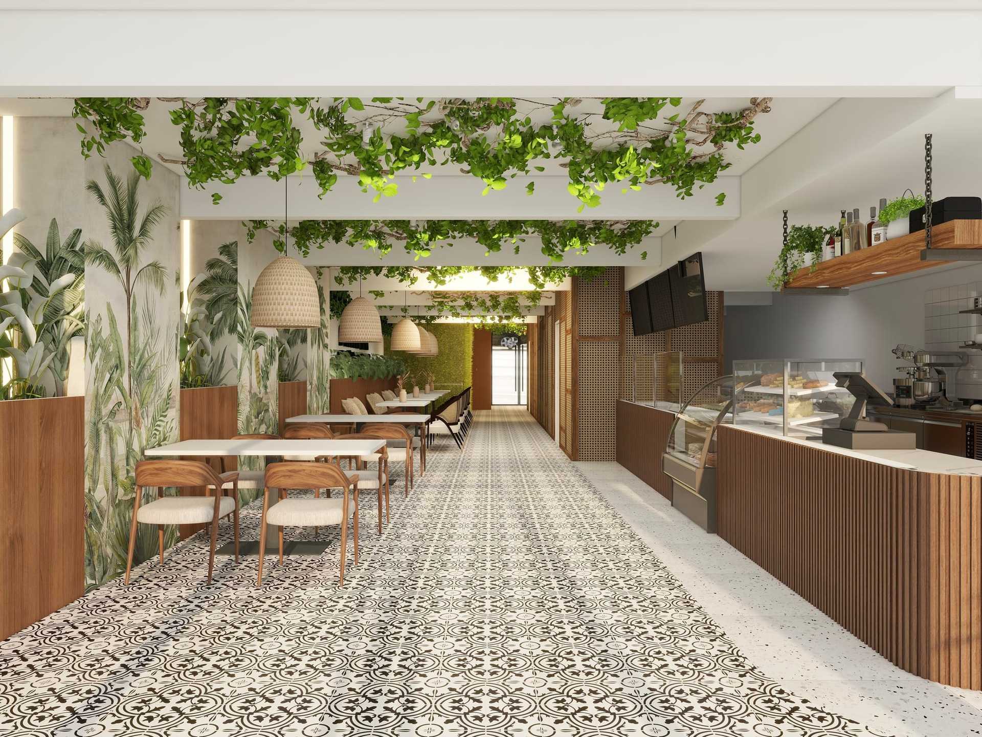 Modern cafe with hanging plants, wooden furniture, and patterned floor tiles.